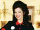 Fran Drescher stands with arms akimbo in character as Fran Fine 021826 1 45224155fd524cebba62484a075f9943